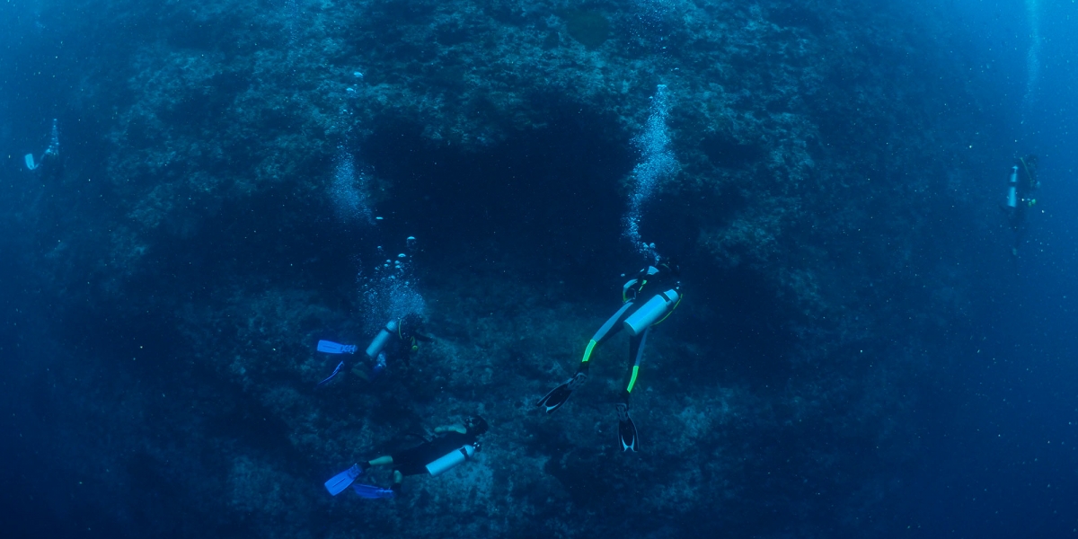 Adventure Deep Dive divers below